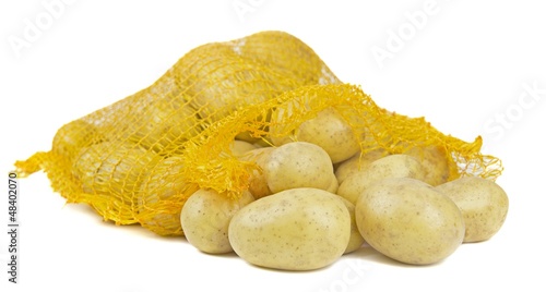 A open bag of potatoes lying on a white background
