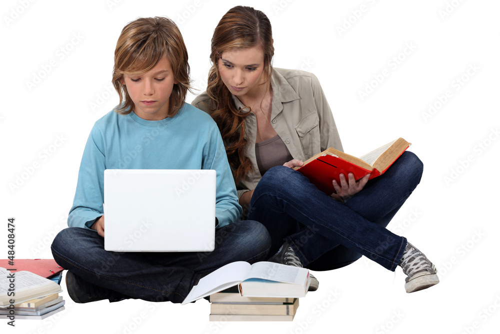 Two teenage friends revising