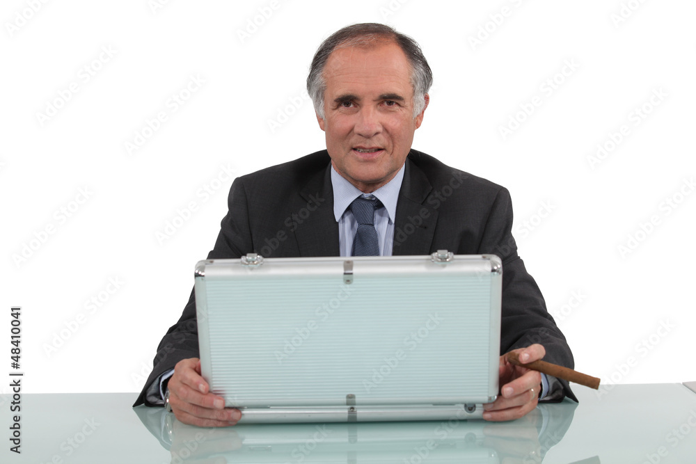 Businessman with a cigar and a briefcase Businessman with a cigar and a briefcase