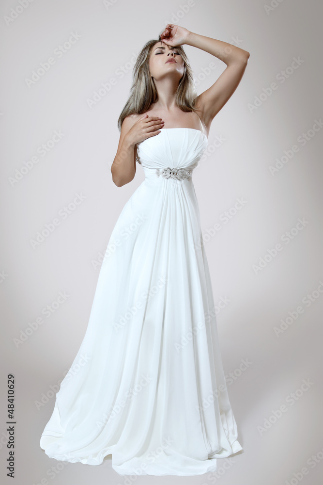 young elegant woman in white trendy dress