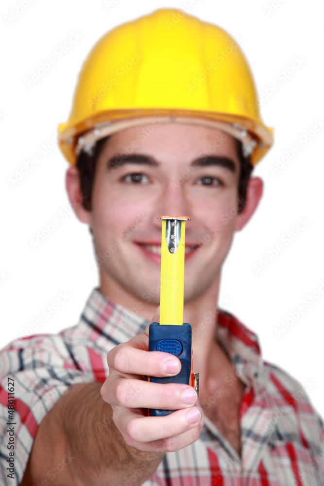 A handyman handing a meter. A handyman handing a meter.