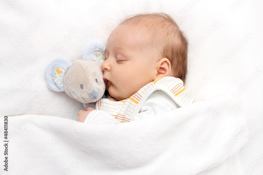 Baby sleeping in bed