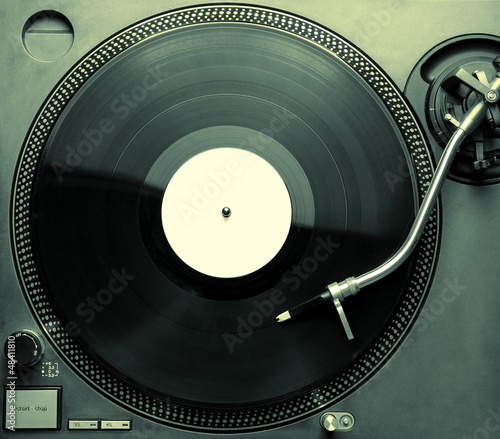 Top view of old fashioned turntable playing a track