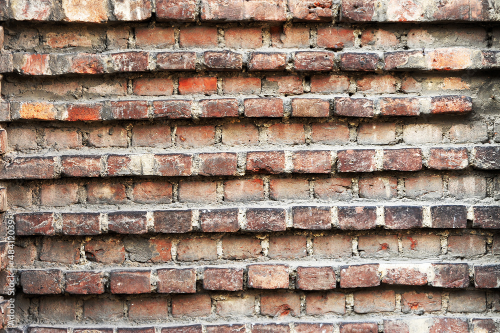 Old grunge wall with indented bricks Old grunge wall with indented bricks