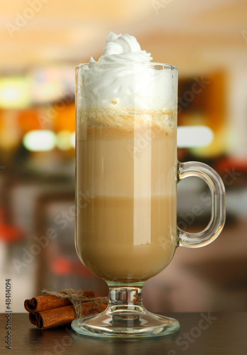 Fragrant coffee latte in glass cup with vanilla pods 