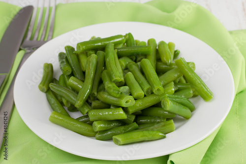 boiled green beans on the white plate