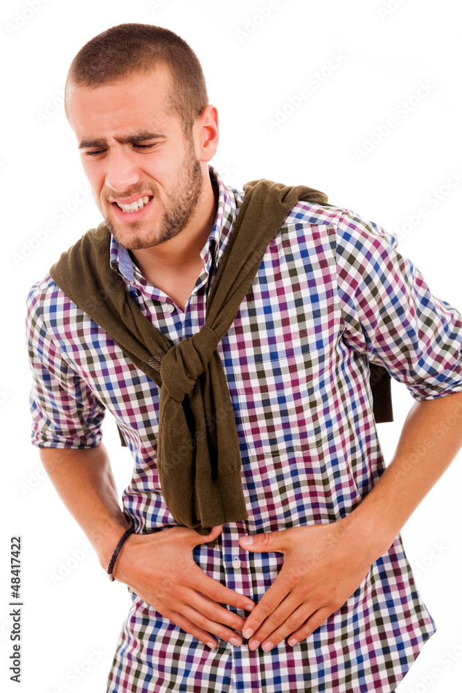 Young man with strong stomach pain isolated on white background Young man with strong stomach pain isolated on white background
