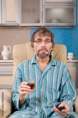 drunk man with glass and cigarette