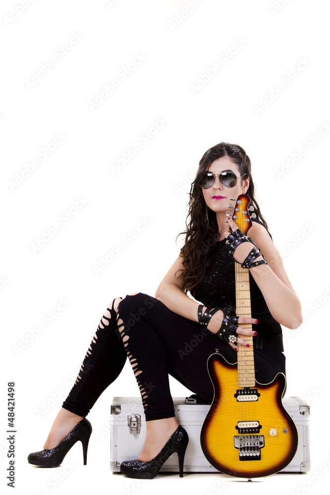 beautiful girl holding an electric guitar