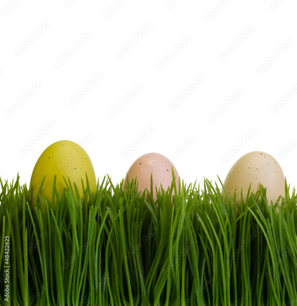 Three colorful eggs on green grass Three colorful eggs on green grass