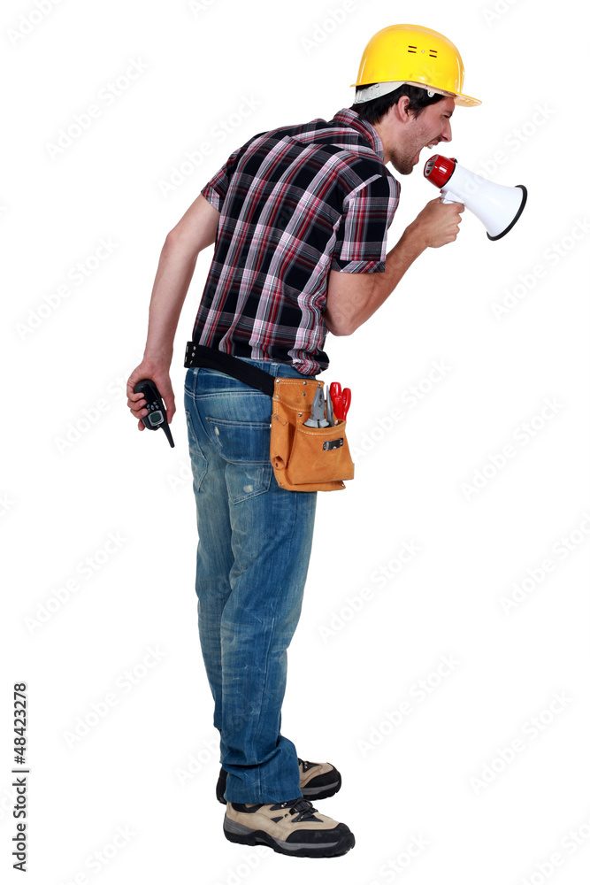 Construction worker shouting into a megaphone Construction worker shouting into a megaphone