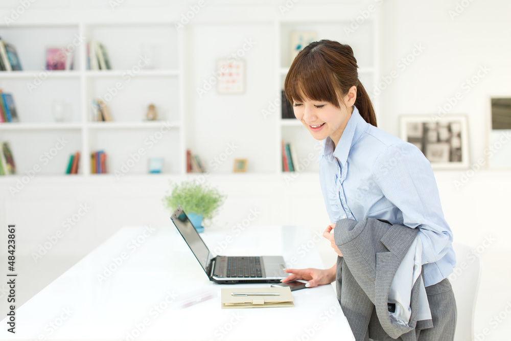 Beautiful young businesswoman working in office Beautiful young businesswoman working in office