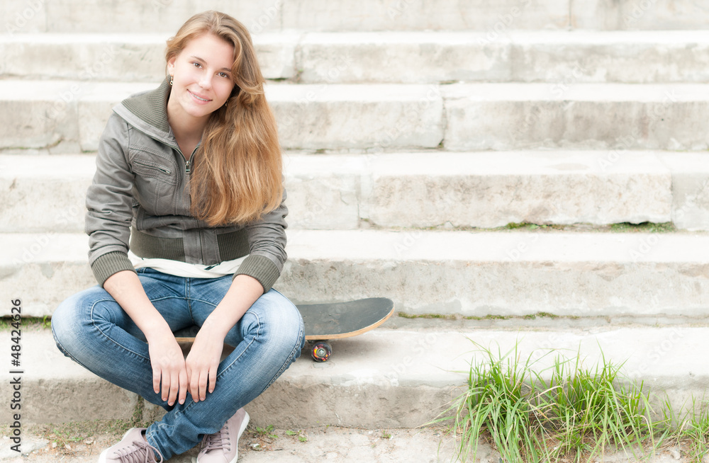 Portrait of pretty girl with skateboard outdoor. Portrait of pretty girl with skateboard outdoor.