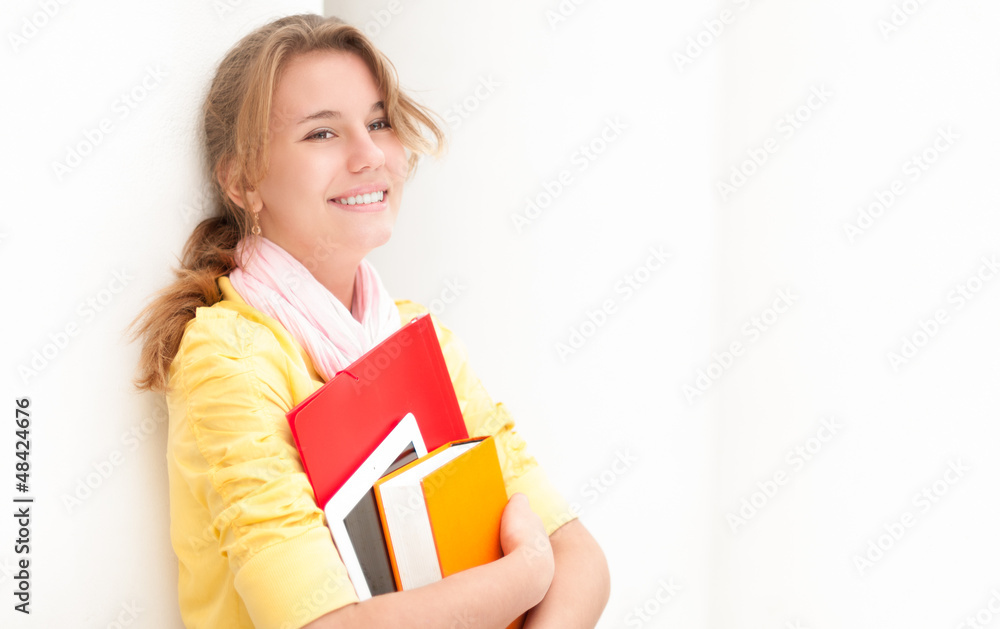 Young pretty female student on white background. Young pretty female student on white background.