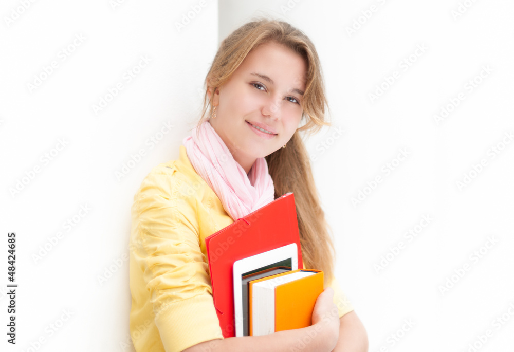 Young pretty female student on white background. Young pretty female student on white background.