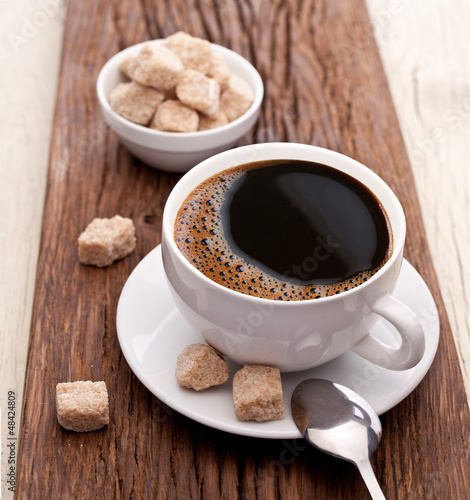 Cup of coffee with brown sugar.