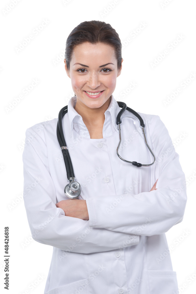 Fototapeta premium Beautiful brunette doctor smiling at the camera with her arms fo