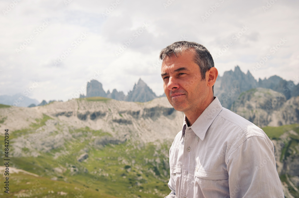 Man portrait outdoor in the mountains. Dolomites, Italy. Man portrait outdoor in the mountains. Dolomites, Italy.