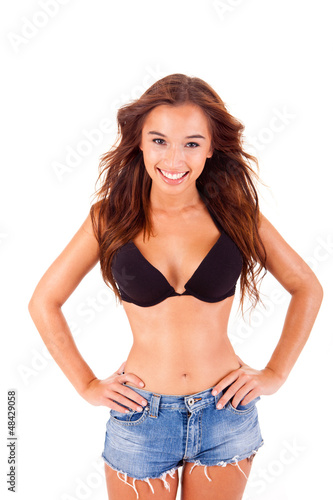 Beautiful young woman dressing bikini and shorts