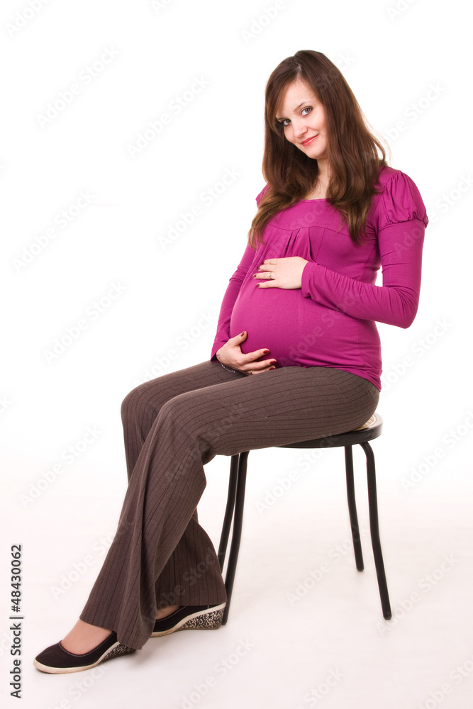 Beautiful pregnant woman - isolated over a white background Beautiful pregnant woman - isolated over a white background