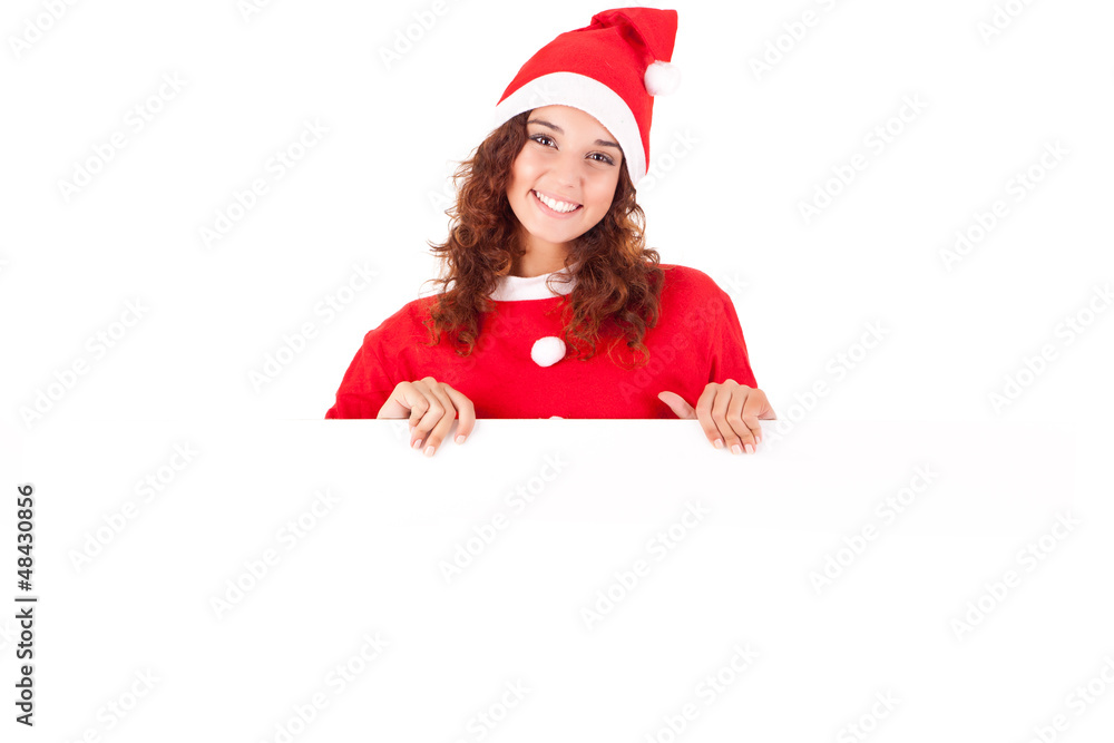 Beautiful smiling young christmas woman leaning on blank sign Beautiful smiling young christmas woman leaning on blank sign