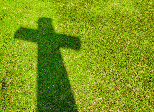 Shadow of Cross on  green grass