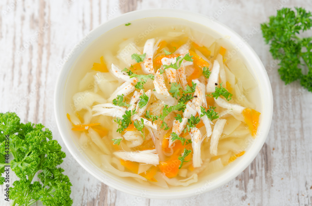 vegetable soup with chicken and parsley top view vegetable soup with chicken and parsley top view