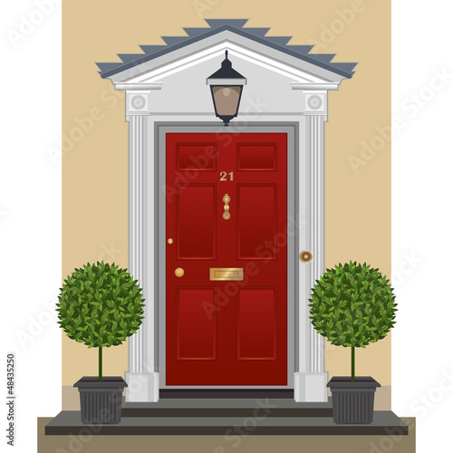 Door. Traditional red painted front door with bay trees  s