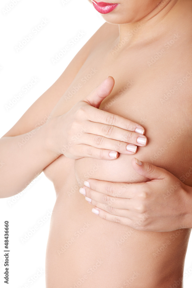 Fototapeta premium Woman examining breast mastopathy or cancer.