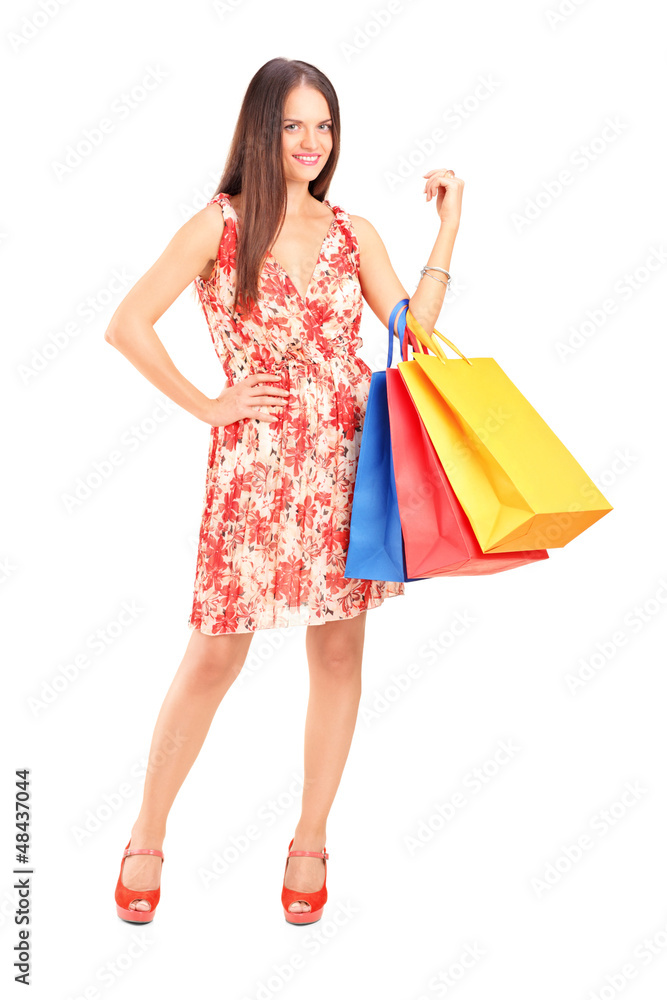 Young beautiful woman holding shopping bags