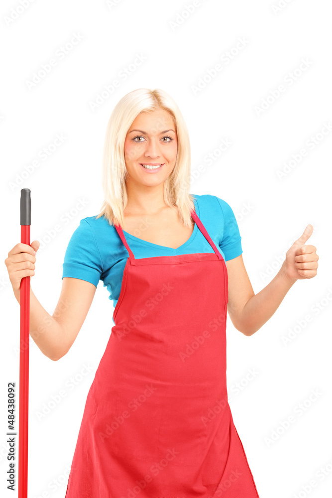 Smiling female cleaner giving a thumb up Smiling female cleaner giving a thumb up