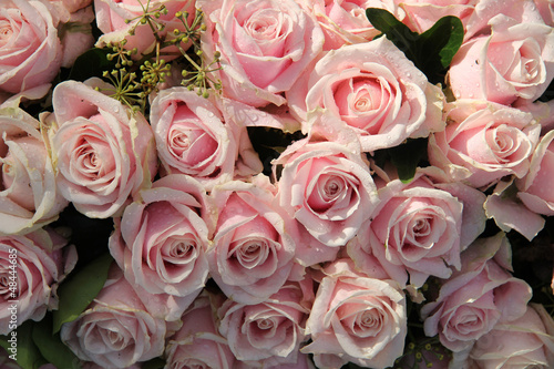 Pink roses in a wedding centerpiece