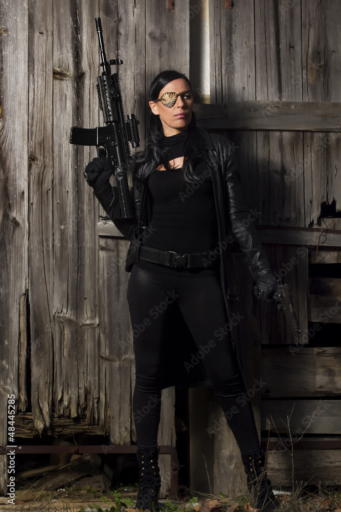 Naklejka premium beautiful girl with weapon