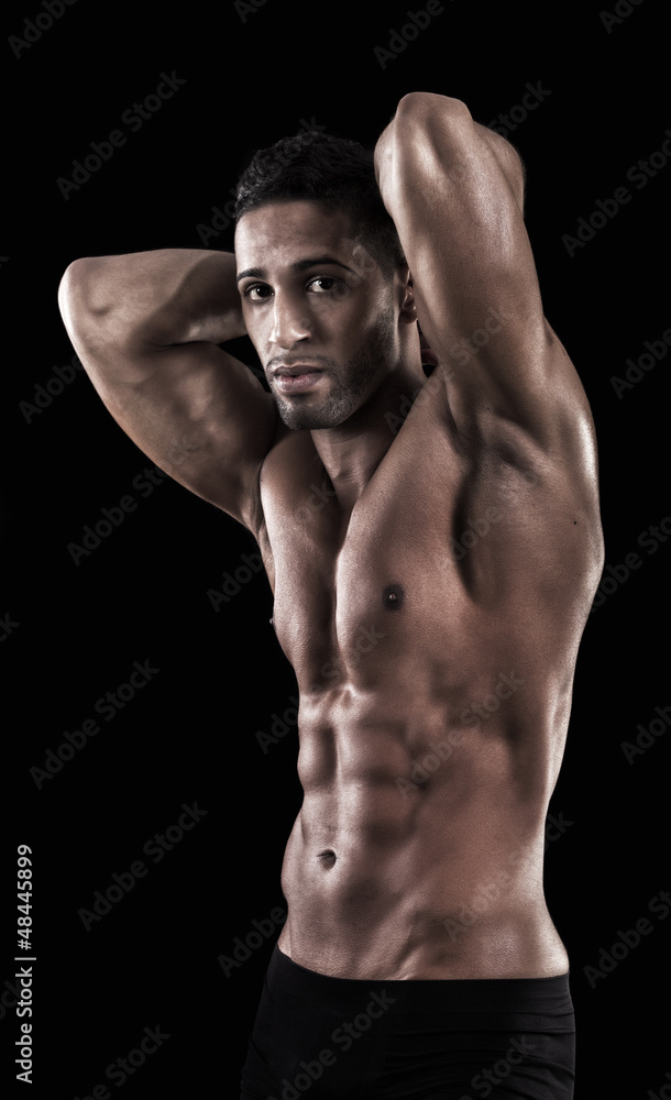 Fototapeta premium muscled man on a black background
