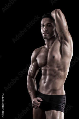 muscled man on a black background