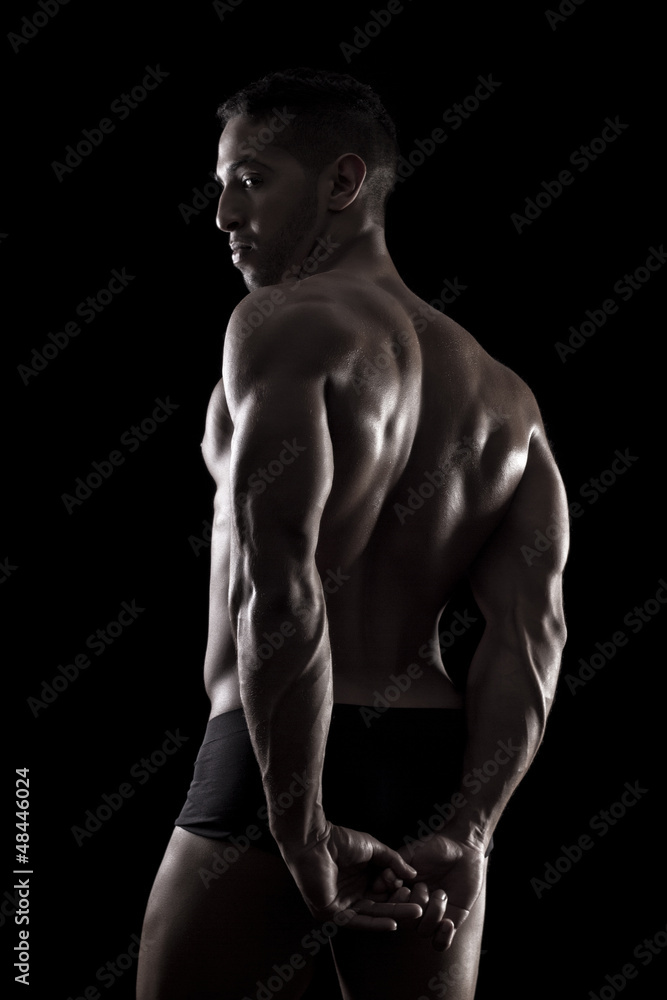 muscled man on a black background