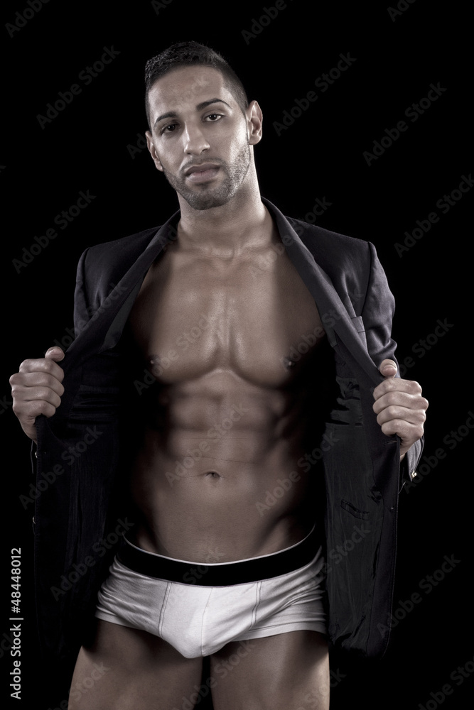 Fototapeta premium muscled man on a black background