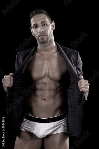muscled man on a black background © Mauro Rodrigues