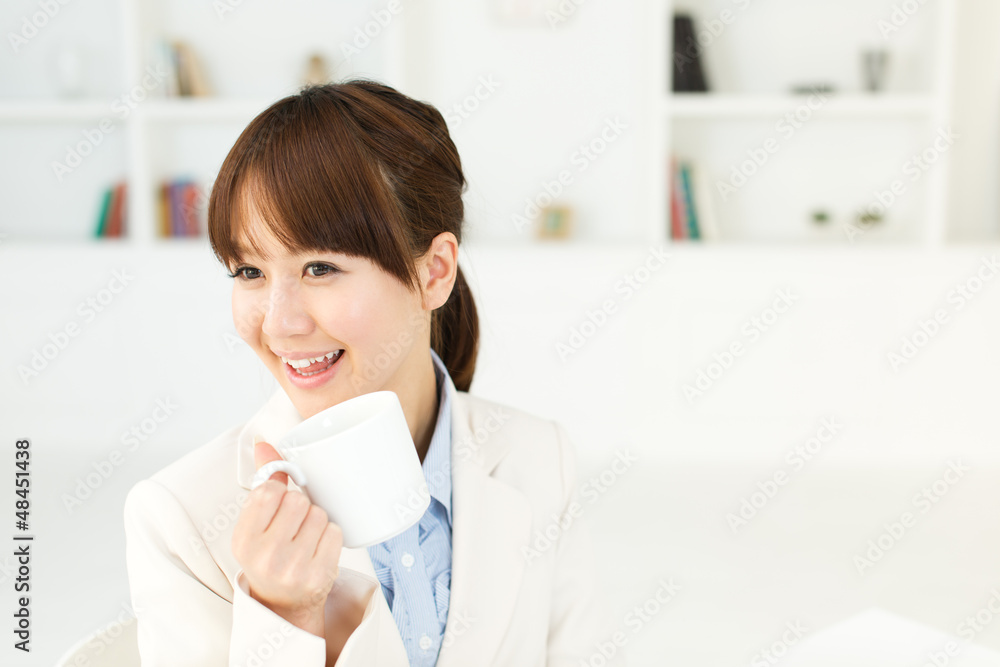 Beautiful young businesswoman working in office Beautiful young businesswoman working in office