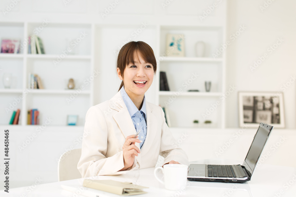 Beautiful young businesswoman working in office Beautiful young businesswoman working in office