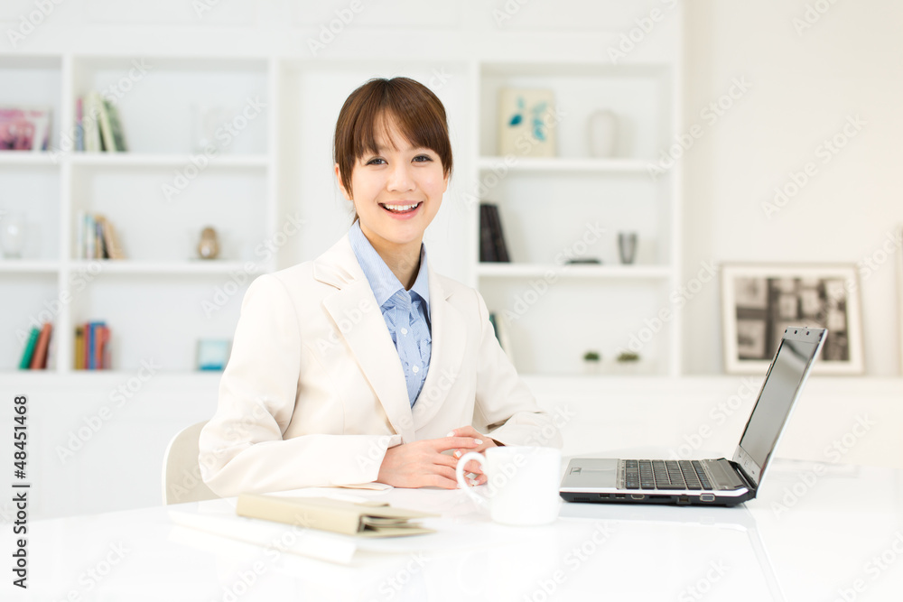 Beautiful young businesswoman working in office Beautiful young businesswoman working in office