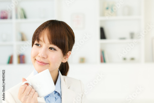 Beautiful young businesswoman working in office Free Download Beautiful young businesswoman working in office - GFXLoad