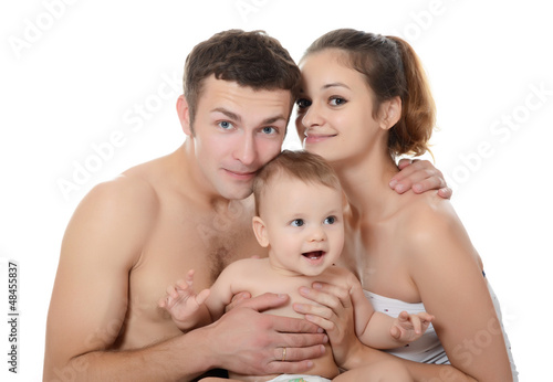 Portrait of a young happy family with the kid