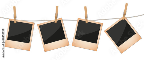 Aged Polaroid Photos Attached to Line by Cloth Spin