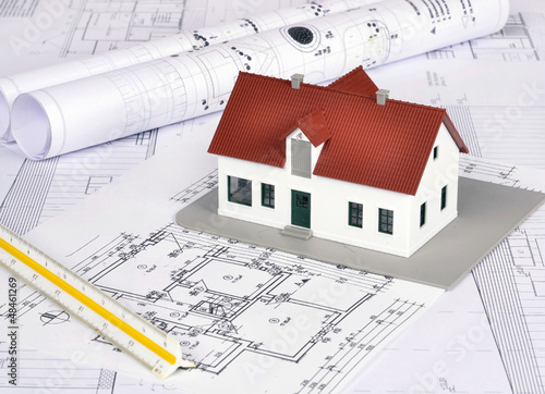 House model on a plan of a house construction