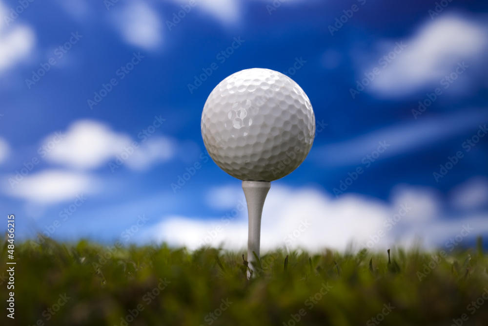 Golf ball on green meadow