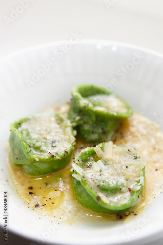 Green ravioli in plate close-up