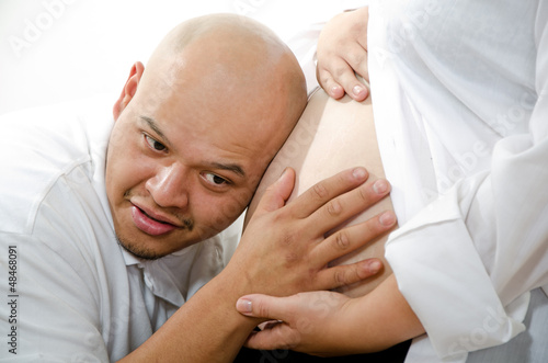 Cute hispanic american pregnant couple