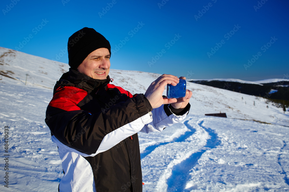 Tourist shooting the landscape with mobile phone