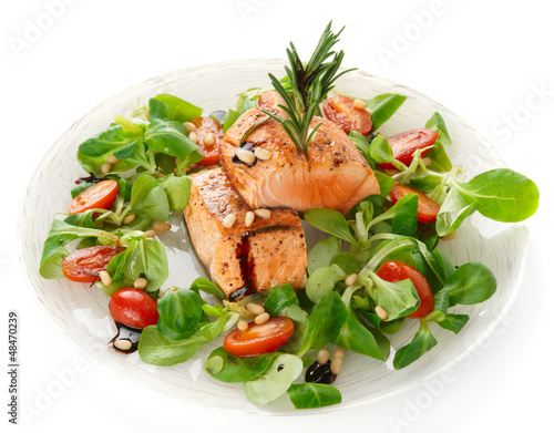 Rare fried salmon steaks isolated on white